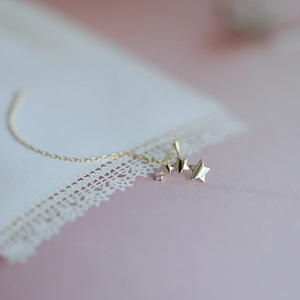 Orecchini pendenti a filo con stella scintillante