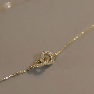 Collier avec pendentif à anneaux entrelacés