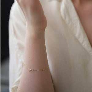 Bow Tie Four Leaf Clover Charm Bracelet