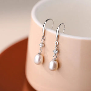 Boucles d'oreilles pendantes baroques en perles