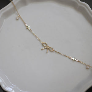 Bow Tie Four Leaf Clover Charm Bracelet