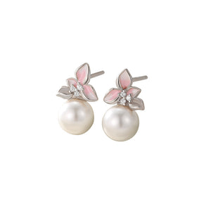 Boucles d'oreilles puces de mariage en perles et fleurs de magnolia