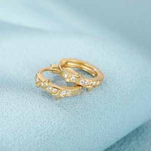 Zarte goldene Stern-Creolen