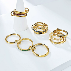 Interlocking multi-band gold rings with colorful baguette crystals, stackable statement ring set