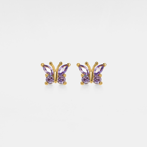 A pair of gold stud earrings in the shape of butterflies with purple cubic zirconia bodies.