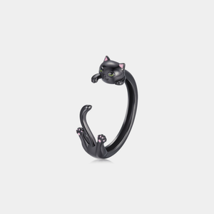 Black cat-shaped wrap ring on a light gray background