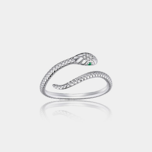 Silver snake-shaped ring with a green gemstone on a light gray background