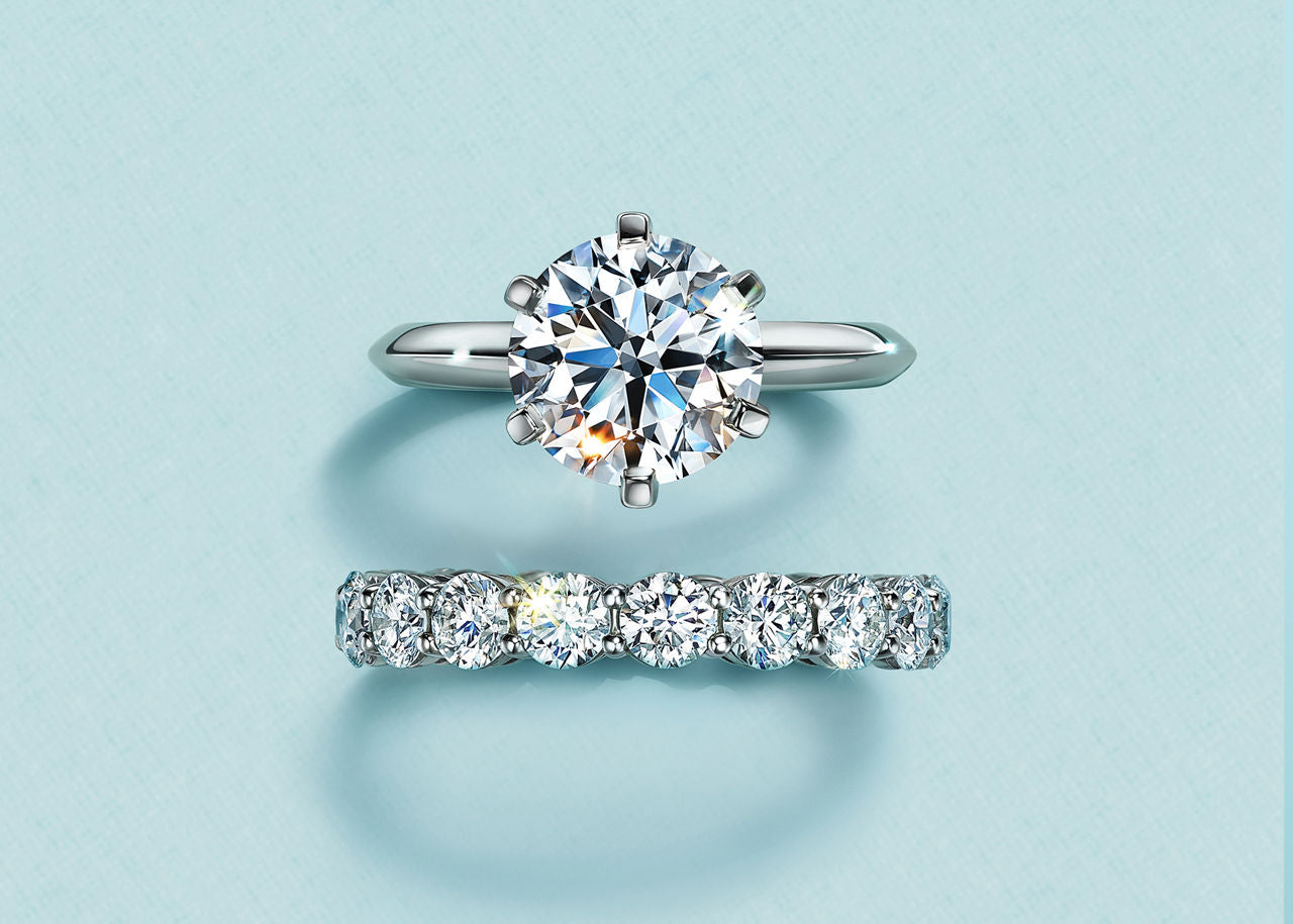 Diamond ring and bracelet on a light blue background