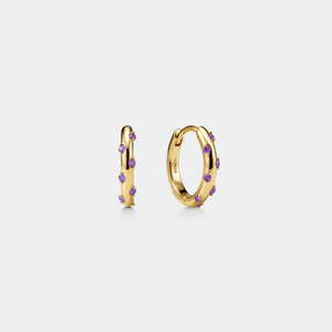 Gold hoop earrings with purple stones on a light gray background