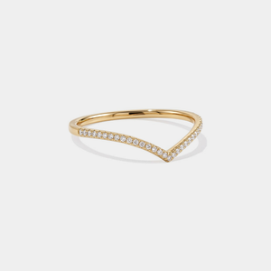 Gold ring with small moissanite on a white background