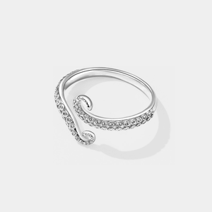 Silver octopus ring on a light gray background