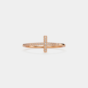 Rose gold ring with diamond accents on a light gray background