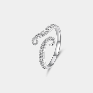 Silver octopus ring on a light gray background