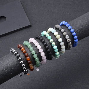 Set of beaded bracelets on a dark surface