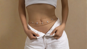 Person wearing a beige waist trainer against a beige background