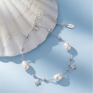 Dainty Pearl Starburst Celestial Charm Bracelet