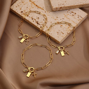 Paperclip Toggle Initial Cross Charm Bracelet