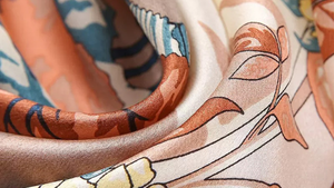 Close-up of a patterned fabric with brown, blue, and white design