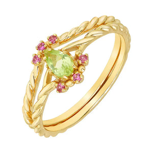 Gold ring with a green and pink gemstones on a white background