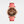Watch with pink strap and floral design on a white background