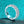 Silver ring with gemstones on a turquoise glittery background