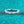 Silver ring with baguette-cut diamonds on a teal textured background