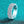 Silver ring with gemstones on a turquoise glittery background