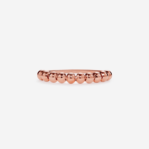 A gold-plated, solid sterling silver adjustable ring with a textured surface and small spinner balls.