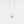 A small round moissanite pendant necklace with a gold chain and a gold setting.