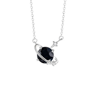 Silver necklace with a black gemstone pendant on a white background