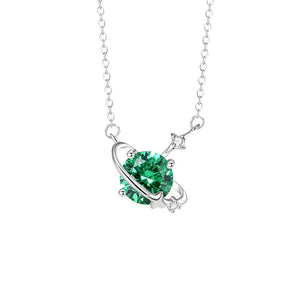 Silver necklace with a green gemstone pendant on a white background