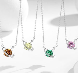 Four heart-shaped gemstone necklaces on white background