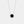 White gold plated round locket necklace featuring a black agate stone center with a halo of small clear stones, on a delicate chain against a white background.