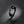 Black cat-shaped ring on a dark gray background