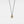 Gold pendant with a blue stone on a black cord against a light gray background