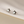 Star-shaped earrings on a beige background