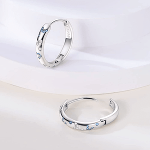 Blue and clear cz butterfly huggie hoop earrings in 925 sterling silver with polished finish and hinged closure