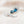 Silver brooch with blue gemstones on a light background