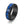 Black ring with blue and black pattern on a white background