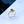 Gold ring with a blue gemstone on a light blue background