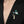 Floral brooch with blue and white design on a black blazer