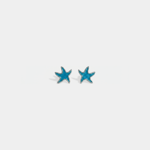 Pair of turquoise color starfish-shaped earrings on a white background