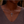 Necklace with a cross pendant worn by a person
