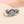 Elegant ring with gemstones on a soft gradient background