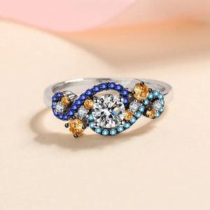 Elegant ring with gemstones on a soft gradient background