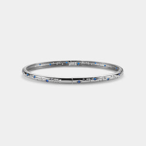 Silver bracelet with blue stones on a white background