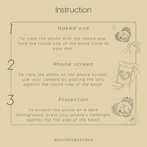 Instruction card showing three ways to view a projection photo jewelry piece: naked eye by holding the bead close to the eye, phone screen using the camera lens against the bead, and projection using a flashlight onto a dark surface.