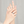 Hand wearing two rings with a plain background