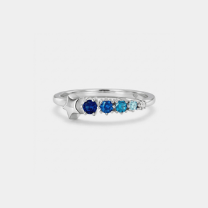 Silver star ring with blue and turquoise gemstones on a white background