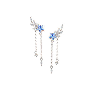 Pair of silver earrings with blue gemstones on a white background